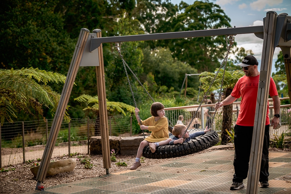 Children on swings  at Olinda Playspace