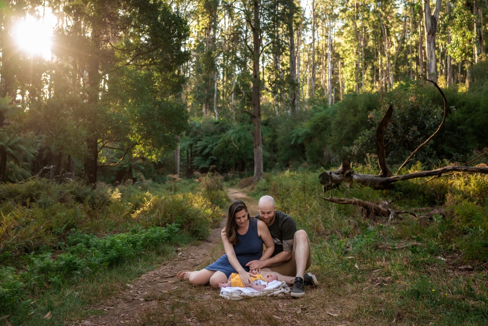 Parents with newborn at dusk in Dandenong Ranges National Park