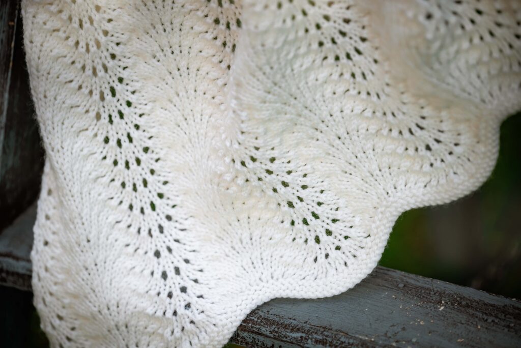 Detailed image of heirloom baby blanket from Etsy store Yarnply
