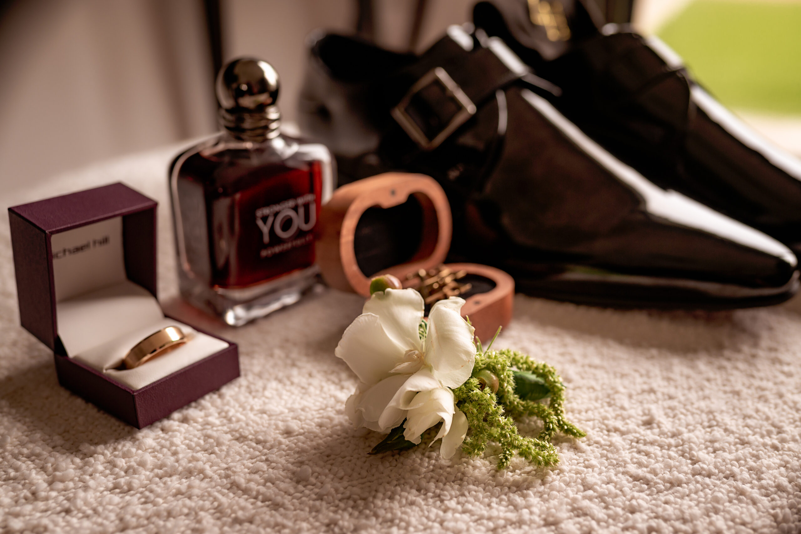 Groom's details including ring, cufflinks, shoes, cologne and boutonniere